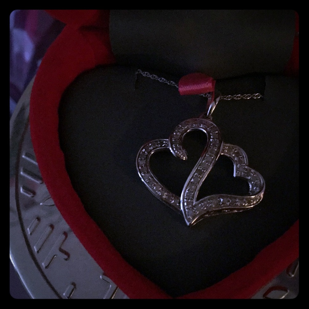 1/2 CTTW diamond necklace set in sterling silver.